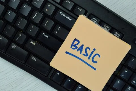 Basic to Learn Computer write on sticky notes isolated on Wooden Table. Stock Photos