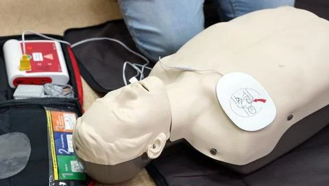 Basic life support simulation scenario for medical students on a dummy with.. Stock Photos