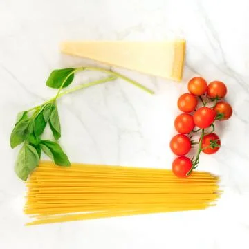 Basic pasta ingredients, including spaghetti and cheese 스톡 사진