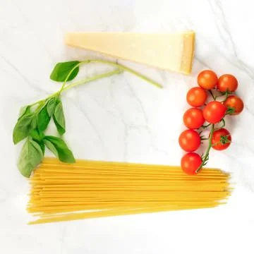 Basic pasta ingredients, including spaghetti and cheese 写真素材