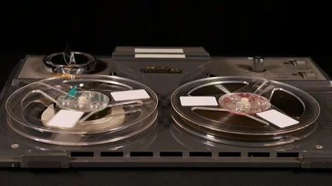 Basic Reel to Reel Tape recorder playing music Video stock 86558120