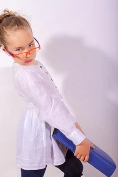 Basic school child with heavy file in the hand Stock Photos