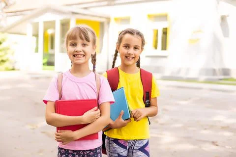 Basic school students crossing the road Stock Photos