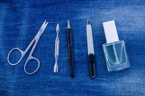 Basic set of manicure tools on jeans background Stock Photos