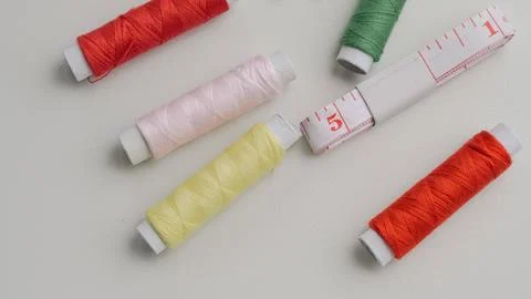 Basic sewing tools with colorful threads and tape for beginner's workshop Stock Photos