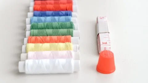 Basic sewing tools with colorful threads and tape for beginner's workshop Stock Photos