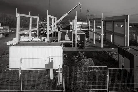 The basic structure of an industrial building is erected on a construction si Stock Photos