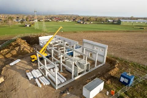 The basic structure of an industrial building is erected on a construction si Stock Photos
