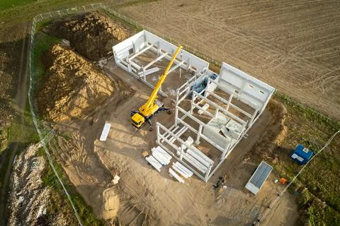 The basic structure of an industrial building is erected on a construction si Stock Photos