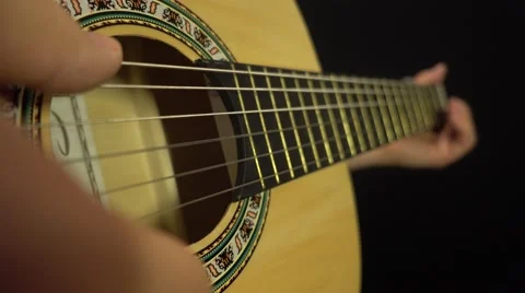 Basic strumming the guitar strings Stock Footage 61608419