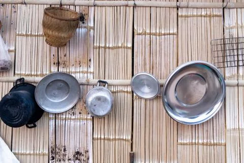 Basic thai kitchen  cooking utensils hung on traditional wood  wall Stock Photos