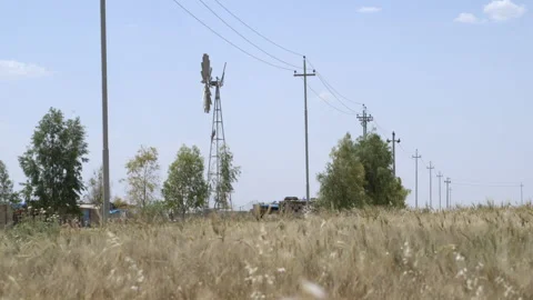 Basic windmill powering a water well in Iraqi Kurdistan Stock Footage 300110868