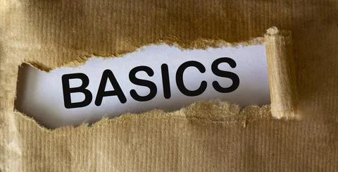 BASIC word on white background seen through torn brown paper Stock Photos