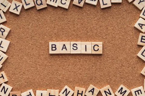 BASIC word written on wood block. BASIC text on wooden table. Stock Photos