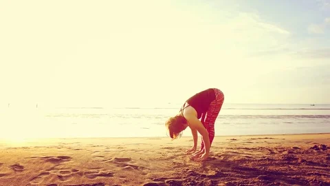 Basic Yoga of young Asian Thai woman on the beach during sunrise to re 스톡 동영상 78722962