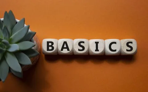 Basics symbol. Concept word Basics on wooden cubes. Beautiful orange backgr.. Stock Photos