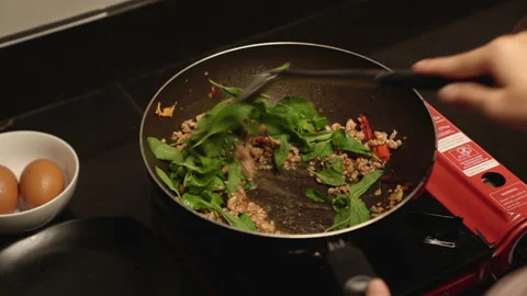 Basil adding medium shot Stock Footage 150420878