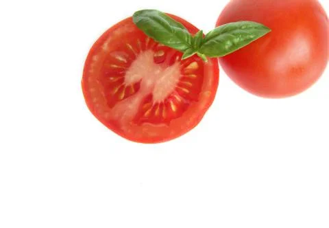 Basil and tomato with white background. Stock Photos