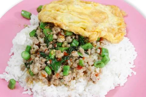 Basil fried pork with omelet &amp; rice Stock Photos