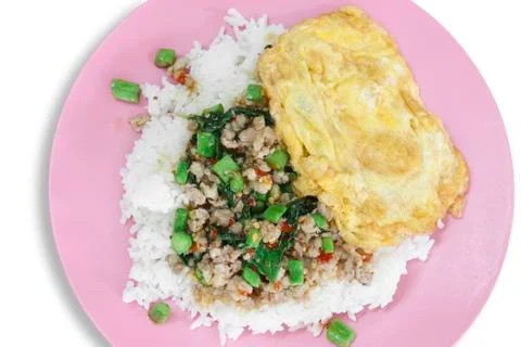 Basil fried pork with omelet &amp; rice Stock Photos