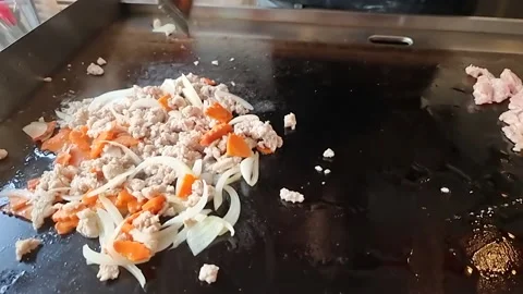 Basil fried rice with minced pork on a hot plate Stock Footage 160709080