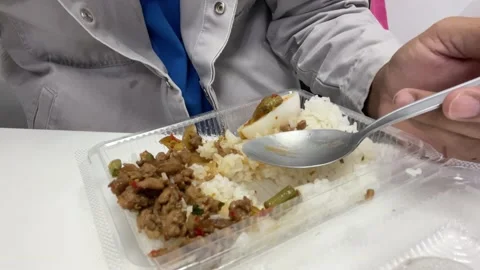 Basil fried rice or Rice with Pad Ka Pao in a delivery box food Stock Footage 164926357