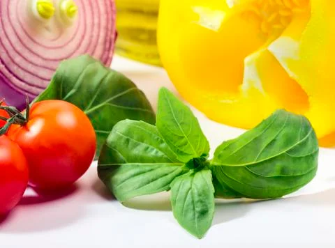 Basil herb with vegetables Stock Photos