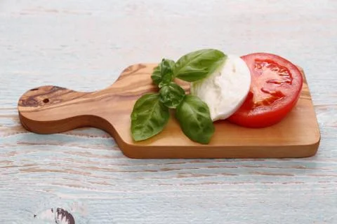 Basil leaf, mozzarella cheese and tomato slice Stock Photos