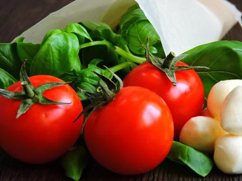 Basil. Mozzarella balls. Cherry tomatoes. Stock Photos