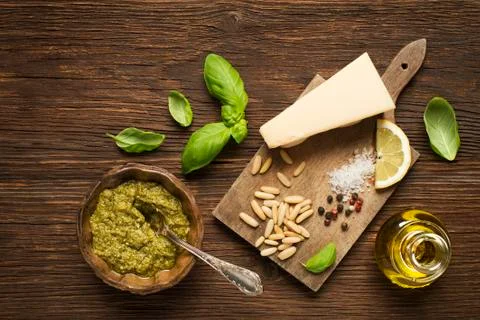 Basil pesto with ingredients. Stock Photos