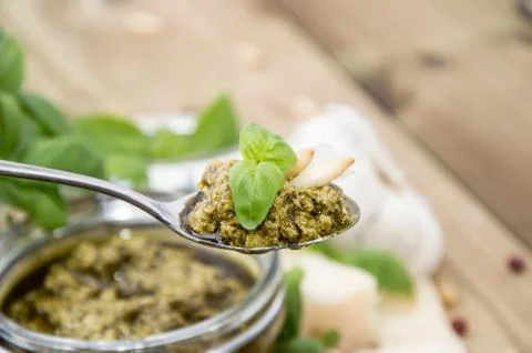 Basil pesto on a spoon Stock Photos