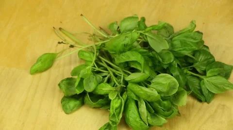 Basil on a wooden boards background Stock Footage 44696949