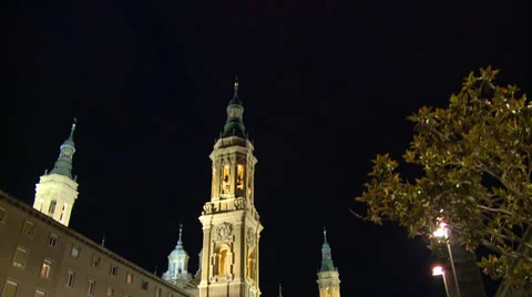 Basilica and square, tilt down at night with few tourists Stock Footage 39323779
