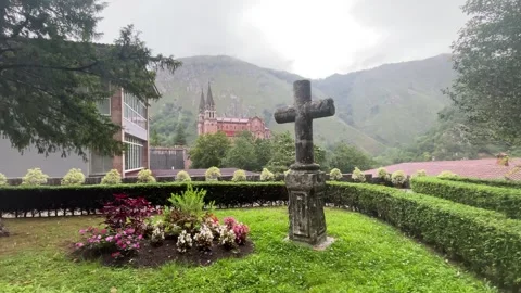 Basilica of Covadonga in the background with a cross in the foreground Stock Footage 260724406