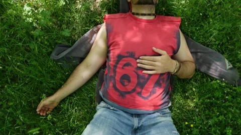 Basilicata, boy sleeps on grass Stock Footage 133941754
