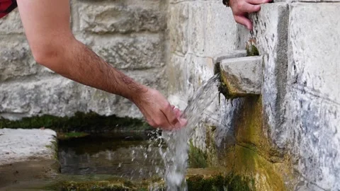 Basilicata, slow motion close up of boy drinks at fountain Stock Footage 133941925