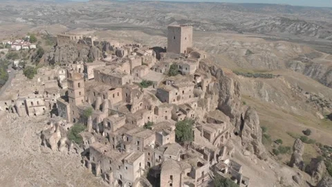 Basilicata, tracking shot of old Craco and Calanchi Stock Footage 259649961