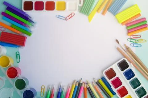 Bask to school. School items, stationery on the table on a white background top Stock Photos
