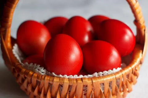 Basket and Red Easter Eggs Stock Photos
