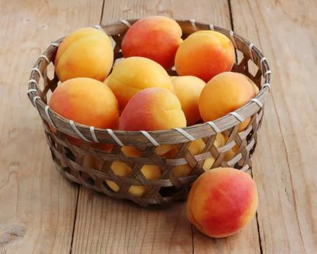 Basket of apricots Stock Photos