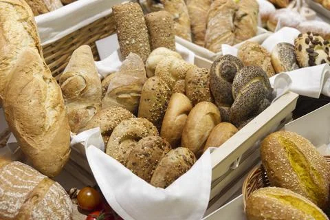 Basket of artisan breads Stock Photos