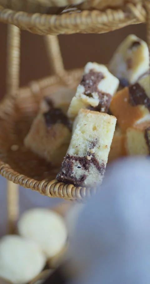 A basket of assorted baked goods  including a chocolate chip cookie Stock Footage 329968742
