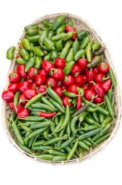 Basket of assorted peppers on display Foto stock