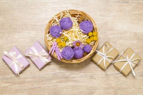 Basket with balls of thread. Gift boxes. 写真素材