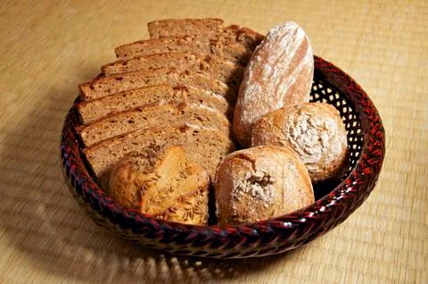 Basket of bread and buns Stock Photos