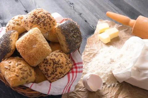 Basket with bread rolls and ingredients Stock Photos