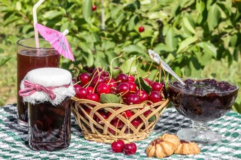Basket of cherries, cherry jam with biscuit, cherry jam jar Stock Photos