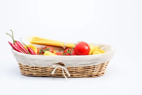 Basket with chilli pappers spaghetti, tagliatelle cherry tomatoes, tomatoes Stock Photos