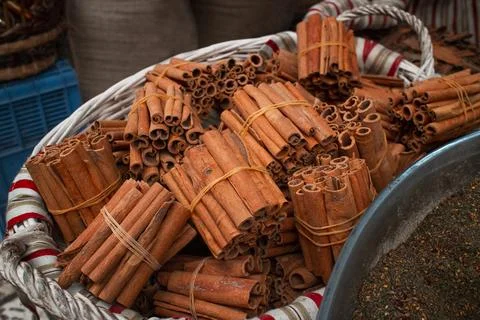 Basket with cinnamon Stock Photos