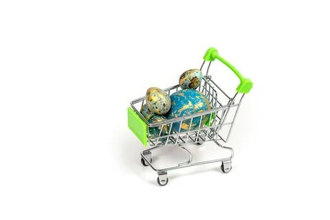.Basket with colored Easter eggs on a white background Foto stock